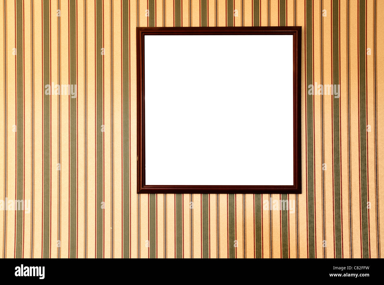 Blank frame on wall with striped wallpaper Stock Photo