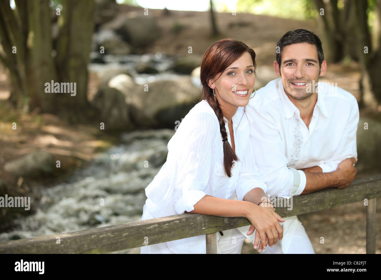 Couple walking in the forest Stock Photo - Alamy