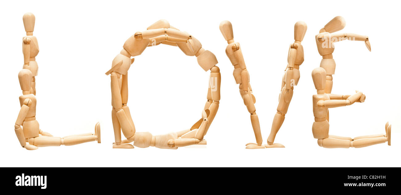 Concept of mannequin in posed word 'Love' Stock Photo