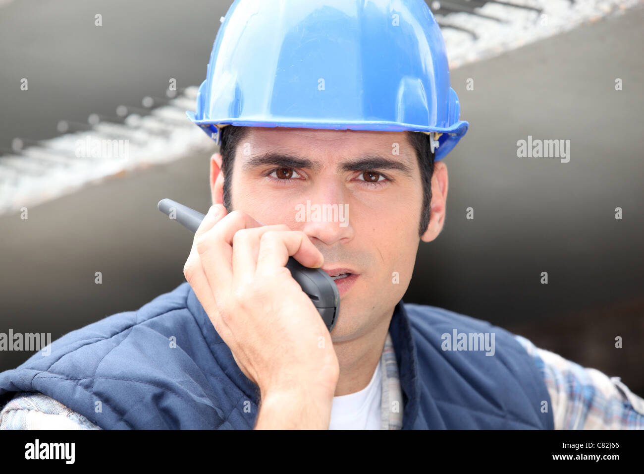 Builder on walkie talkie Stock Photo