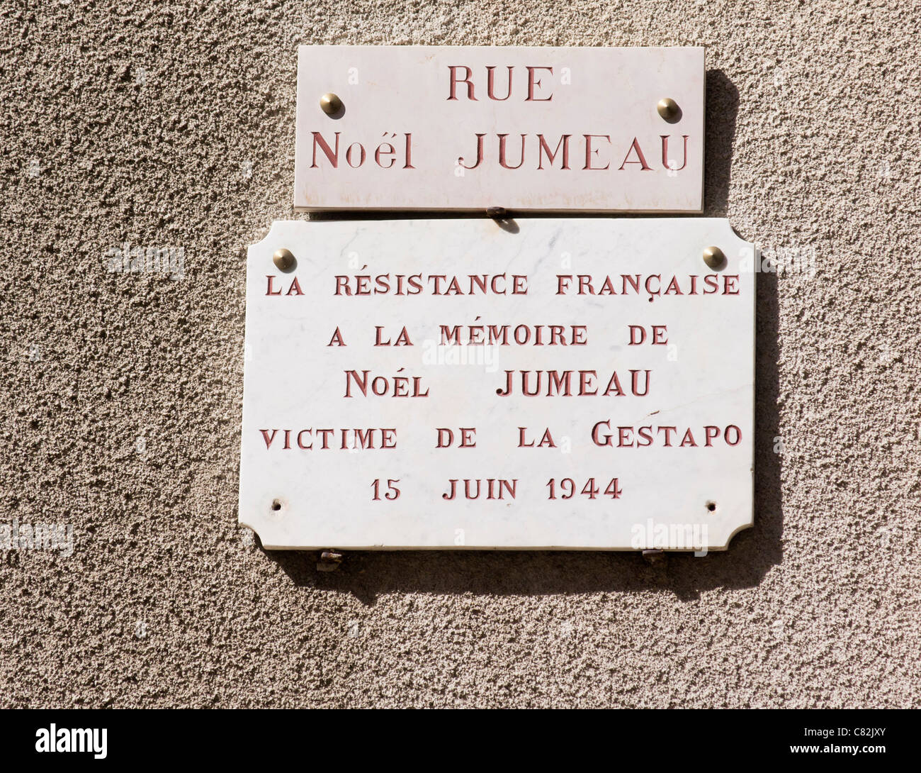 Plaque commemorating the French Resistance on a wall in a village. Stock Photo