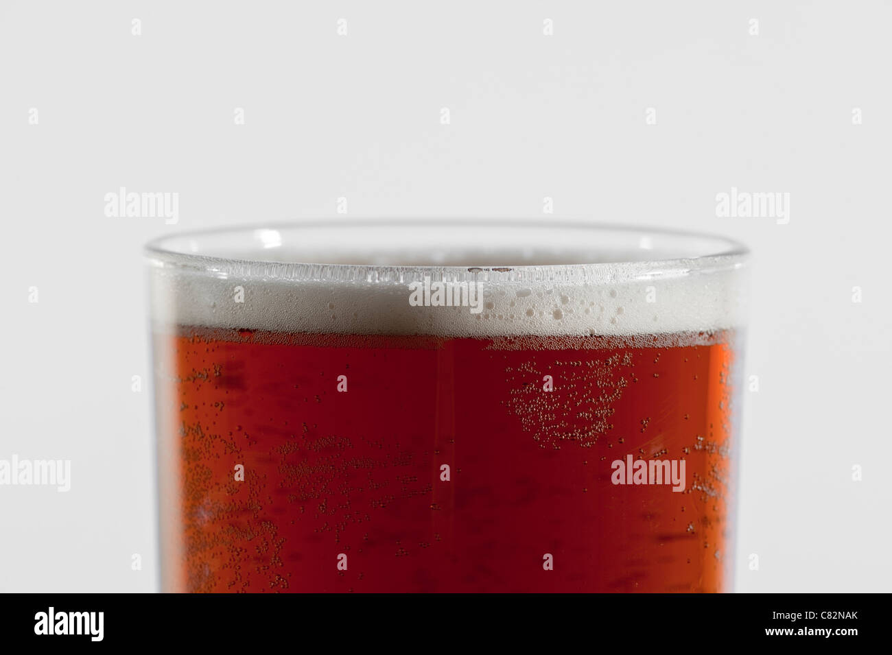 A glass of bitter / ale / beer on a white background Stock Photo