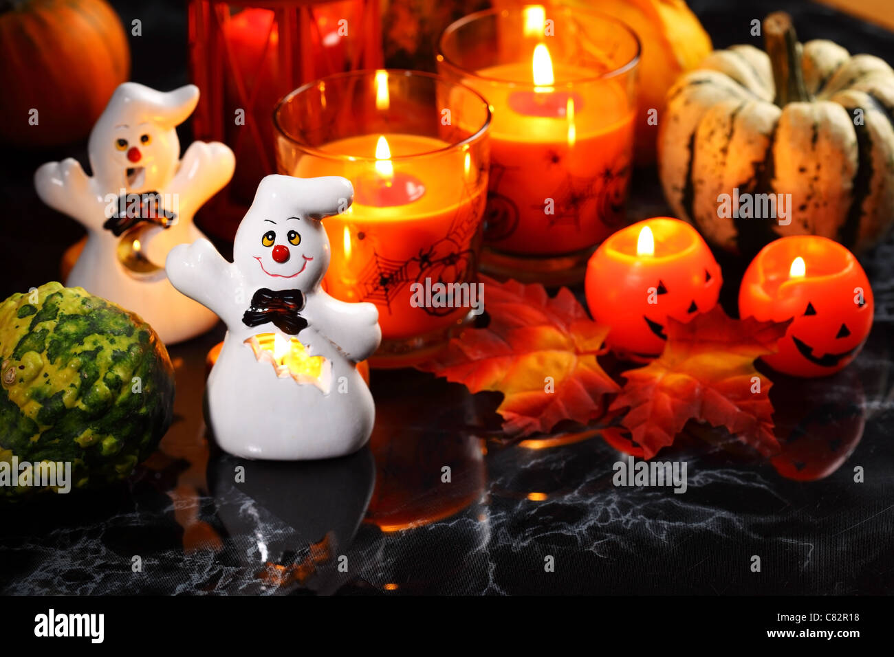 Halloween candlelight with pumpkins on black background Stock Photo