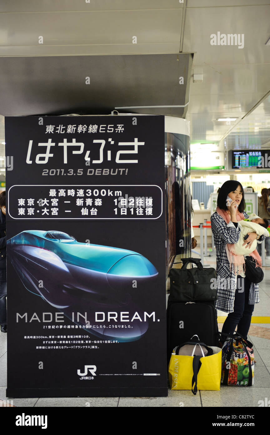 Families taking the bullet train west amidst worries about radiation in Tokyo, Tokyo station, Tokyo, Japan, March 15, 2011. Stock Photo