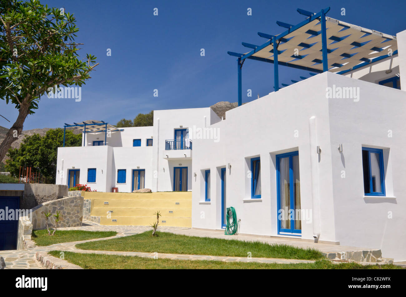 Whitewashed Greek Island holiday houses on Tilos Island, Greece Stock