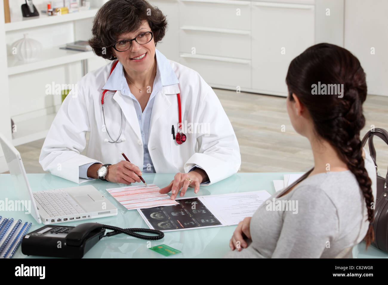 Pregnant woman in doctors appointment Stock Photo Alamy