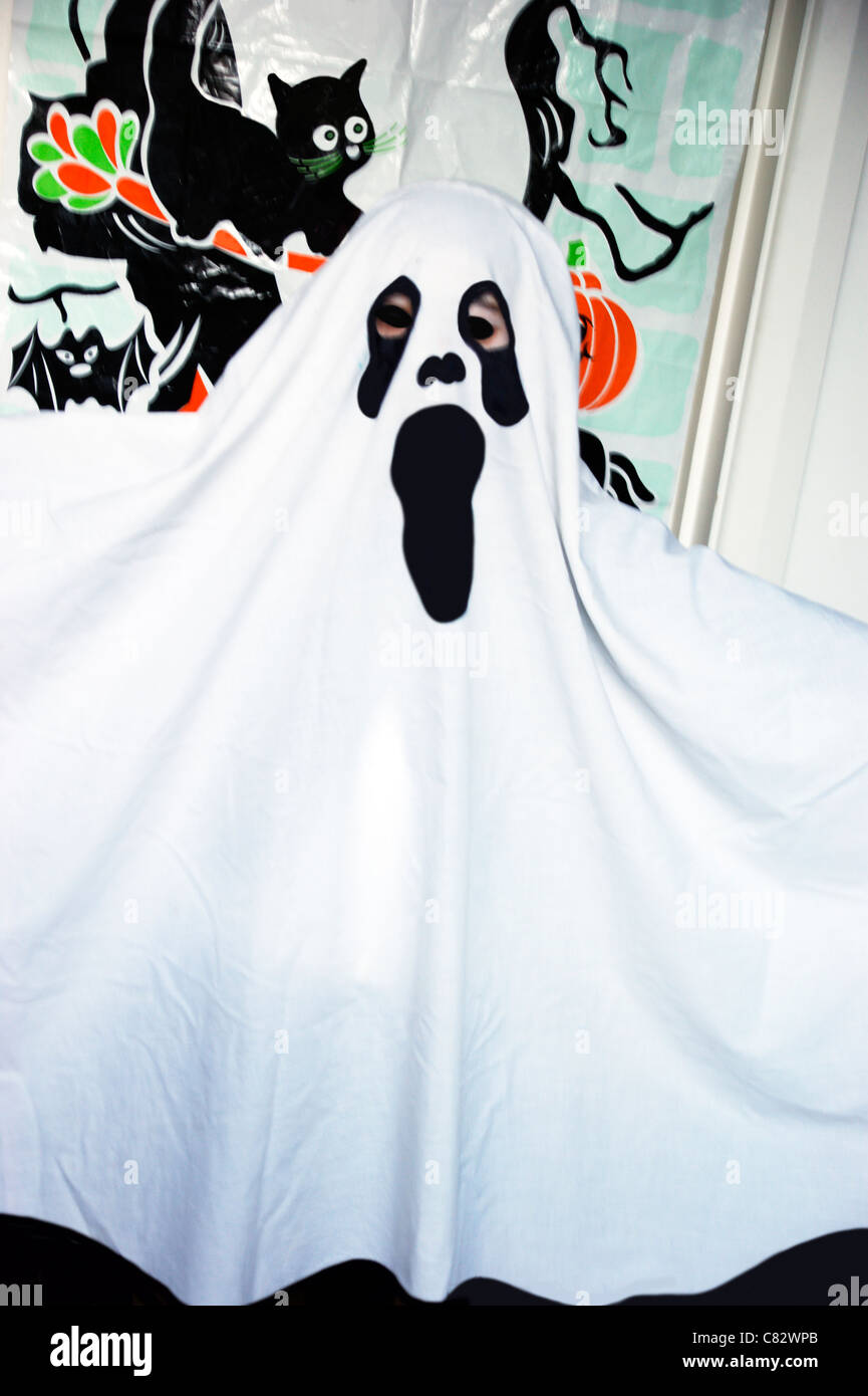 Girl dressed in a ghost costume for a Halloween party Stock Photo
