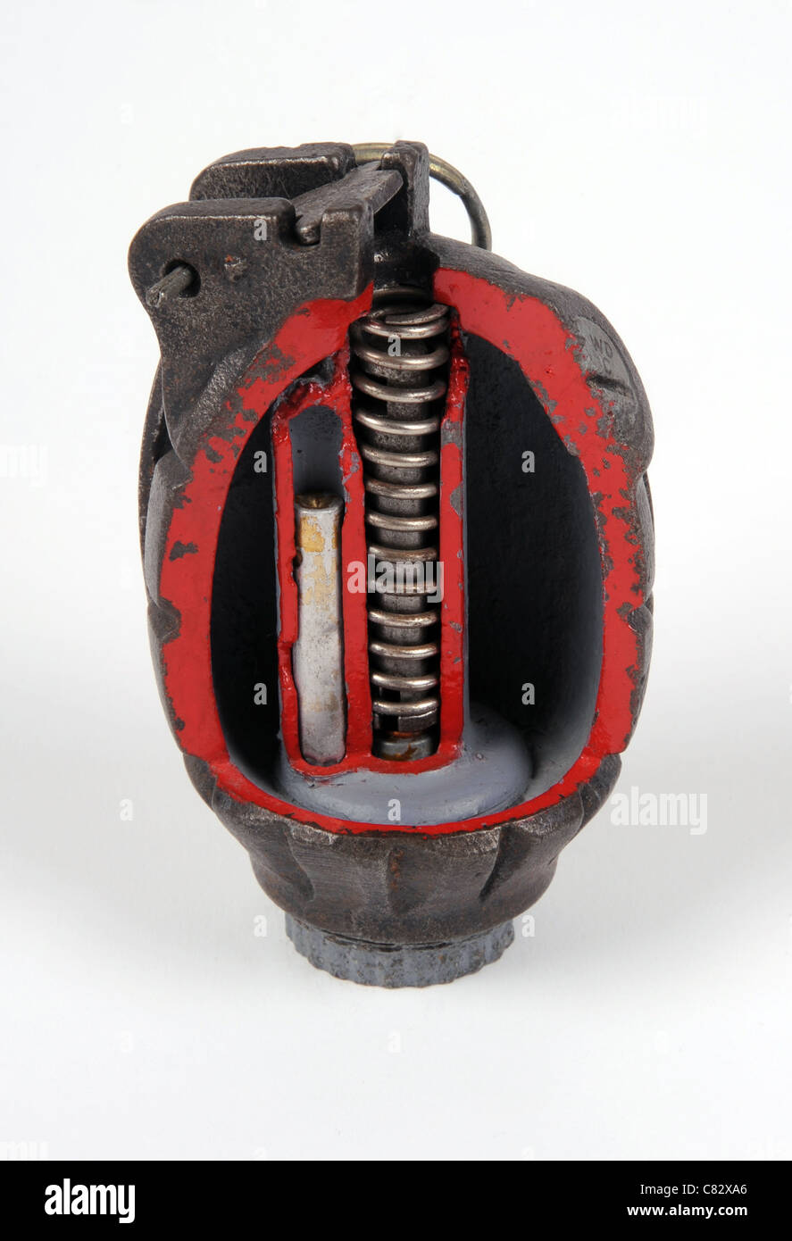 WWII British No36 Mills fragmentation defensive hand grenade with casing cut away for training to show detonator. Stock Photo