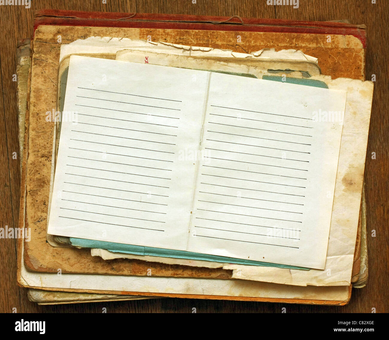 a stack of old papers with a clean sheet Stock Photo Alamy