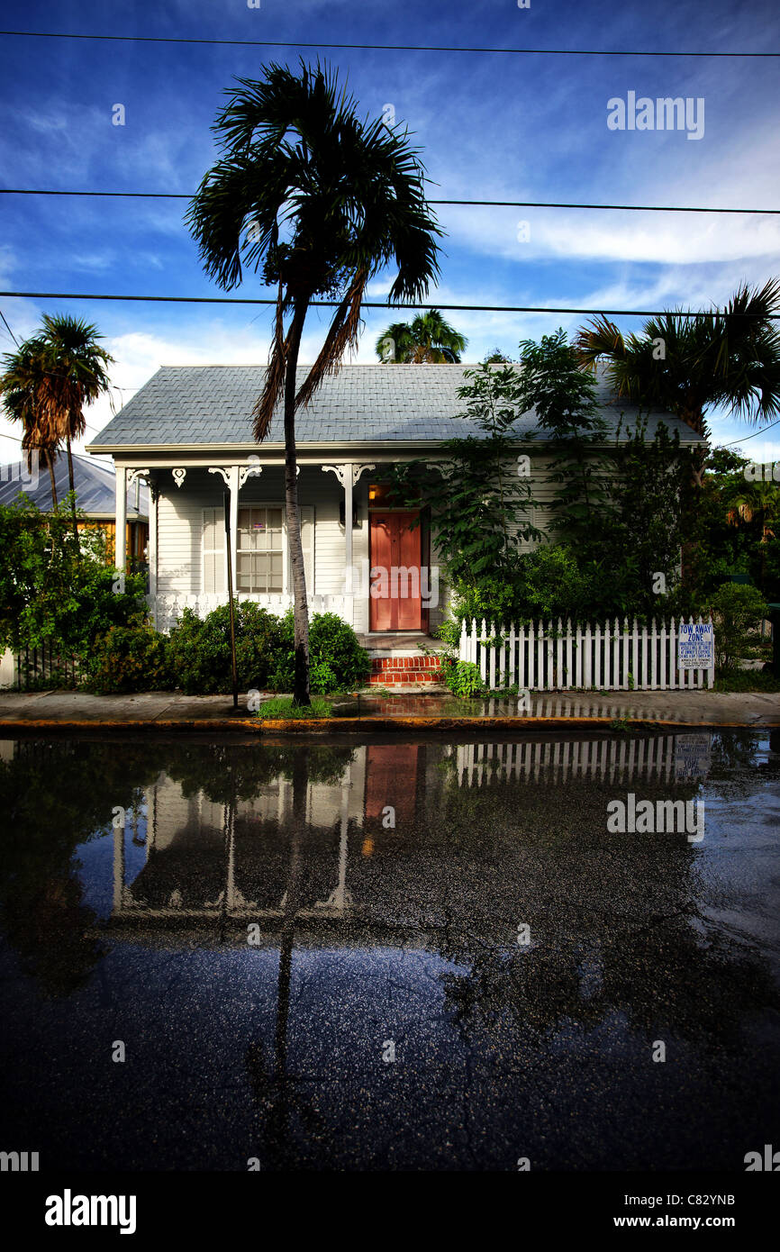 key west house with reflection on the street after rain Stock Photo Alamy