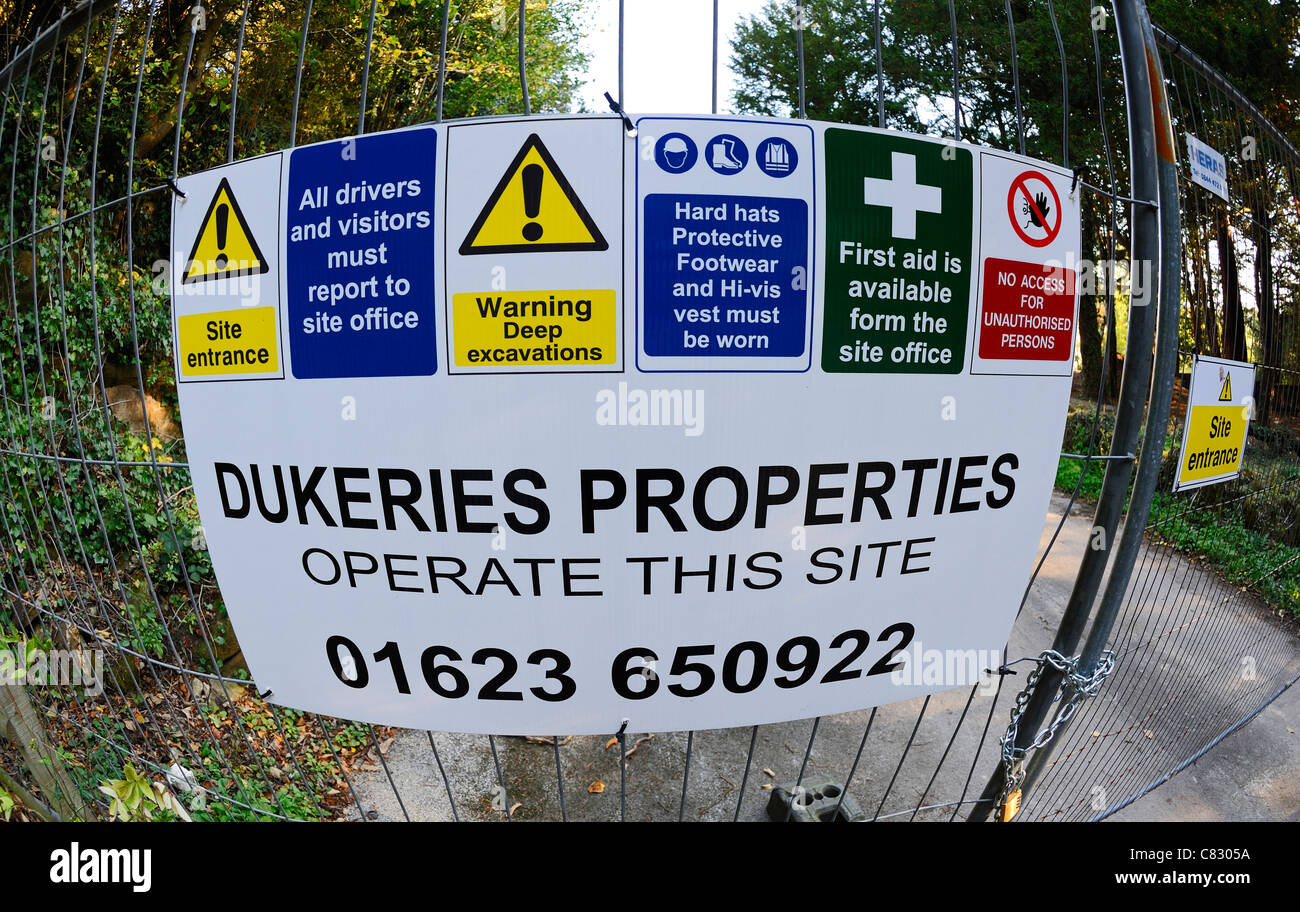 Construction warning and safety signs at the entrance to a construction site. Stock Photo