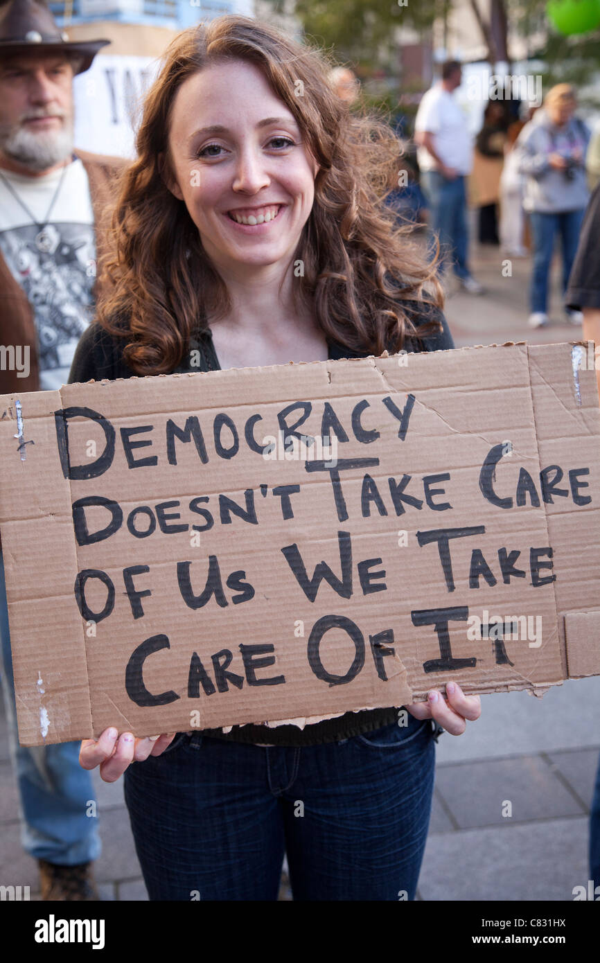 Woman holding sign hi-res stock photography and images - Alamy