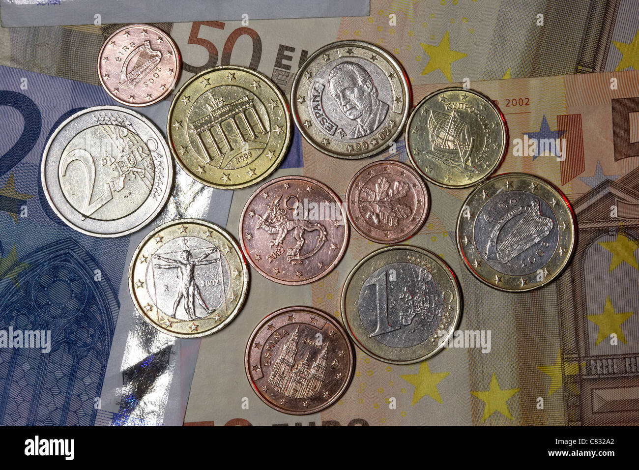 various countries euro banknotes and coins euros from spain italy ireland germany finland cyprus Stock Photo