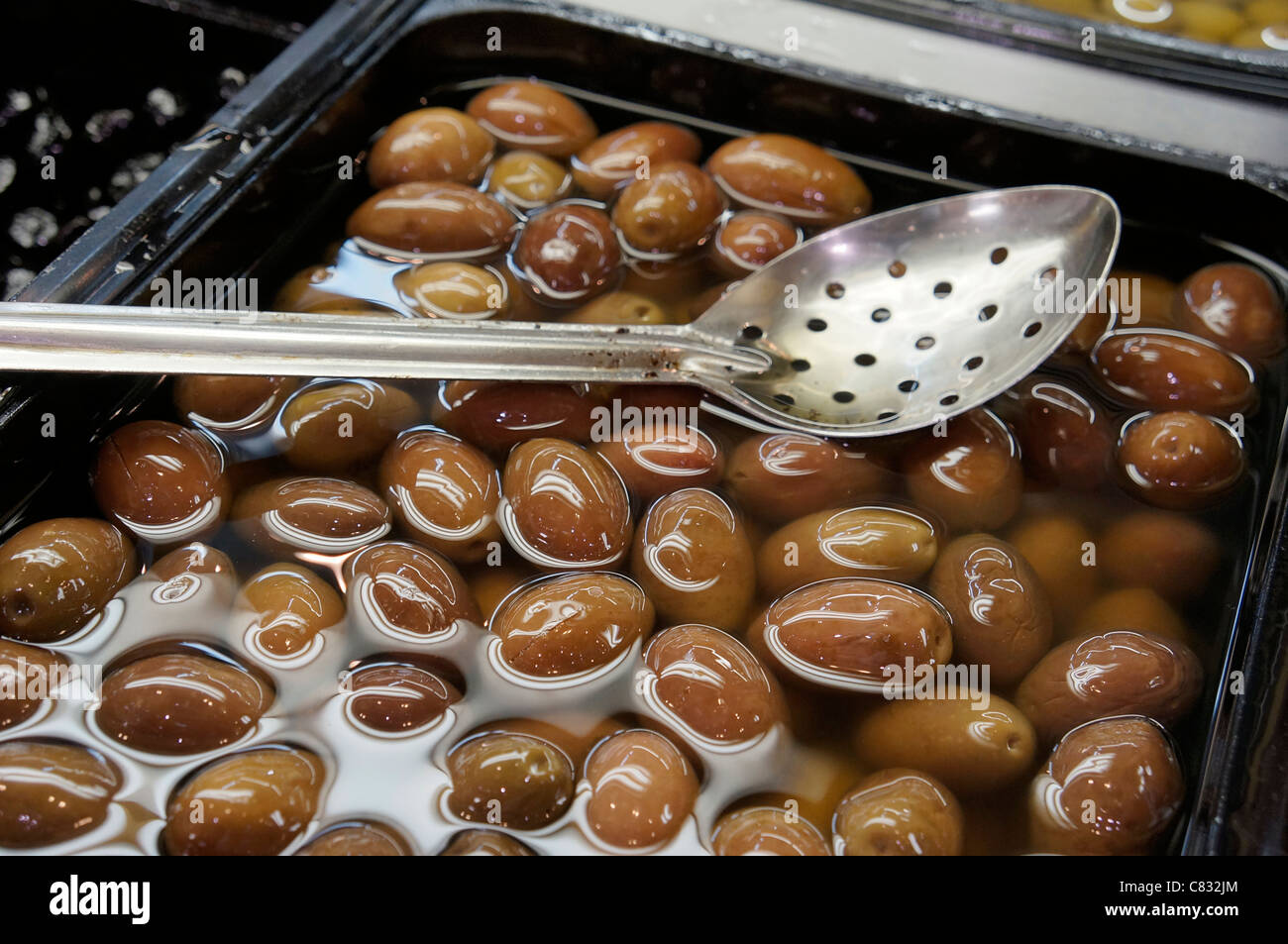 Marinated Brown Olives Stock Photo