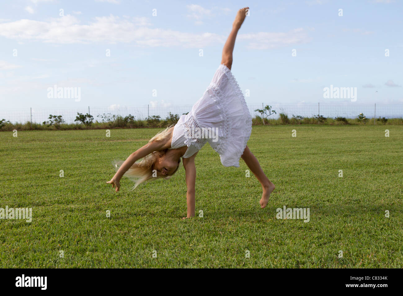 Girl doing a cartwheel Stock Photo