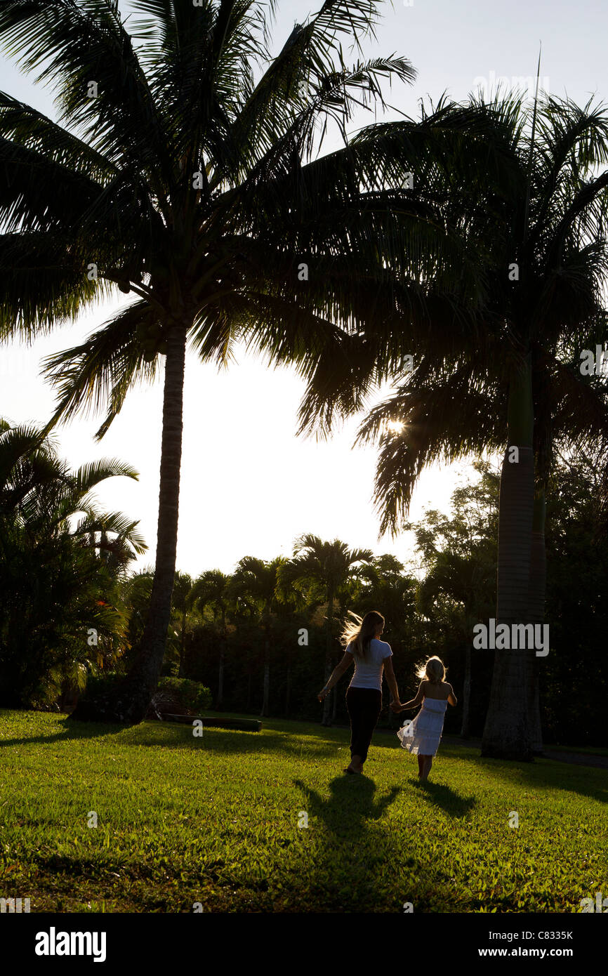 Couple walking together during sunset Stock Photo - Alamy