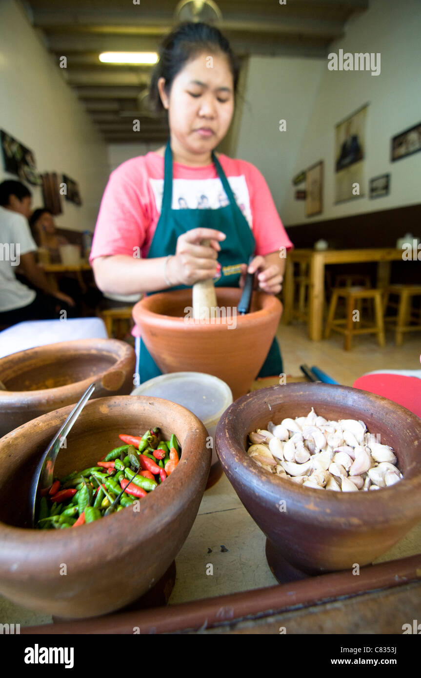 A Thai woman preparing Green Papaya salad - Som Tam. Stock Photo