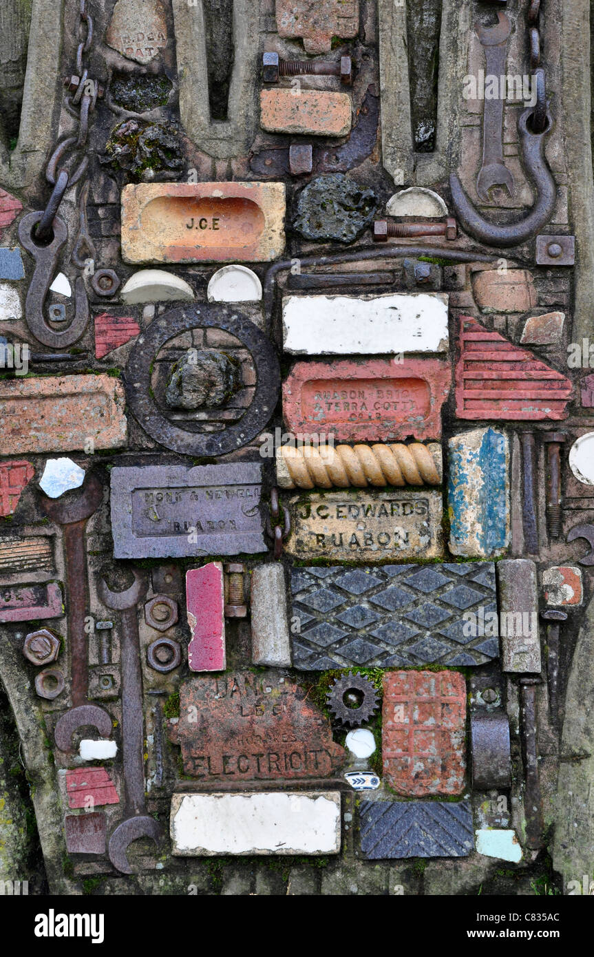 A brick and tool montage made into a sculpture of man made objects UK