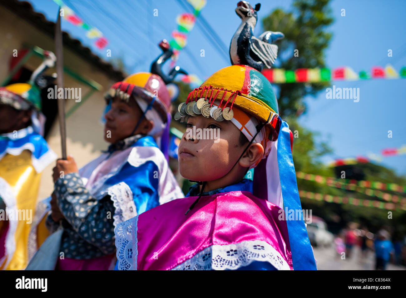 Salvadoran boys perform the traditional dance during the Flower & Palm Festival in Panchimalco, El Salvador. Stock Photo