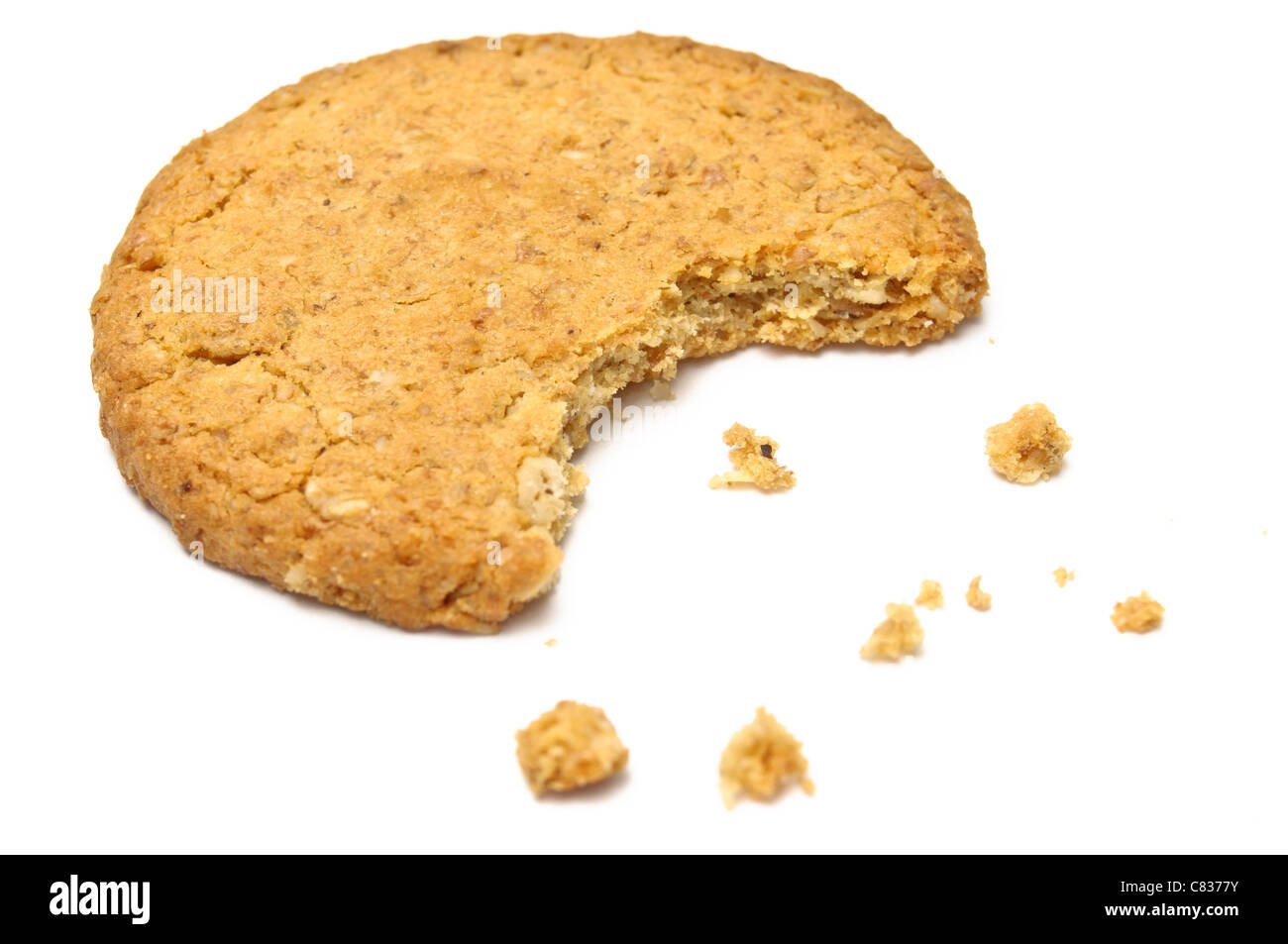 Cookie with crumbs side view isolated on white Stock Photo Alamy
