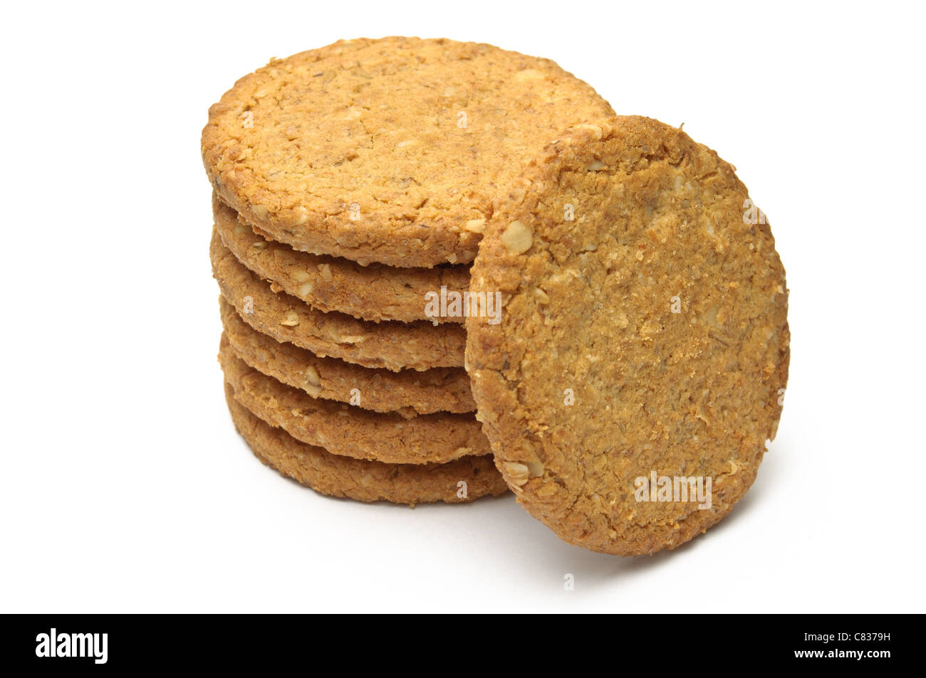 Cookie tower supports an upright one isolated on white Stock Photo