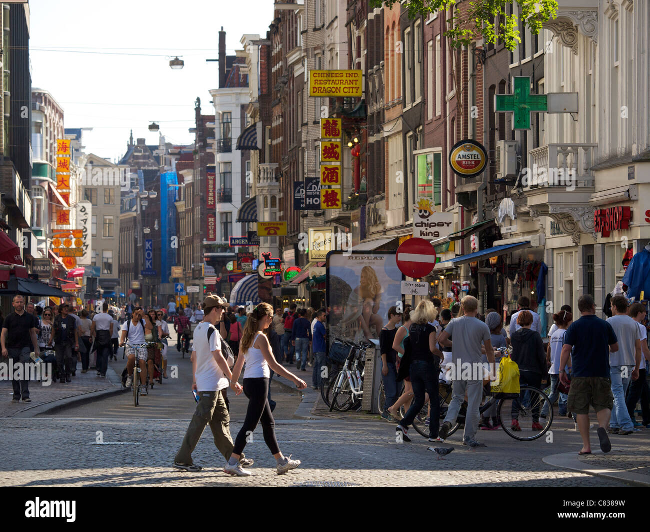 Damstraat Dam street with many people in Amsterdam, the Netherlands Stock Photo