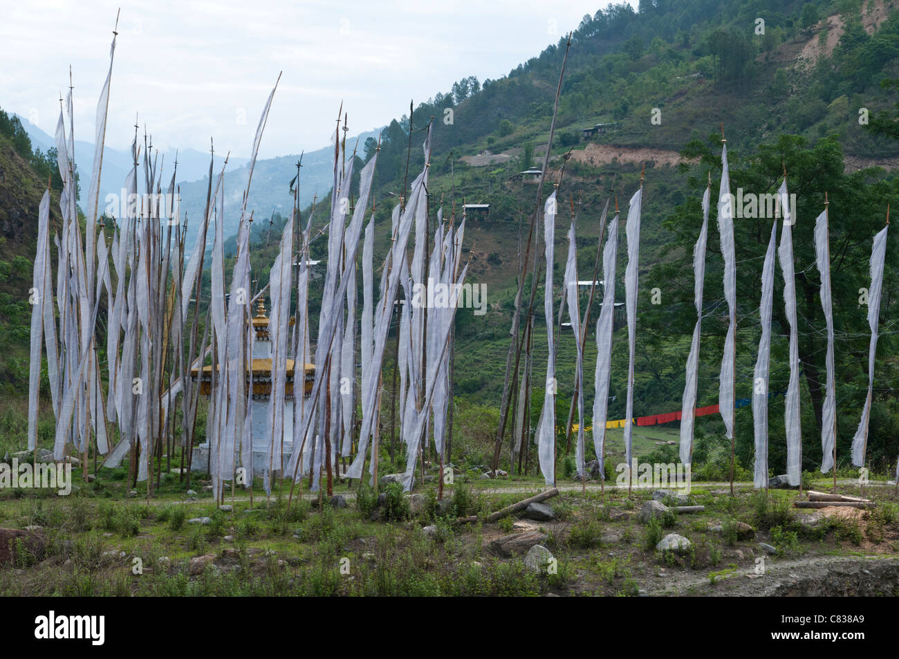 Prayer flags and chorten near Radi. eastern Bhutan Stock Photo