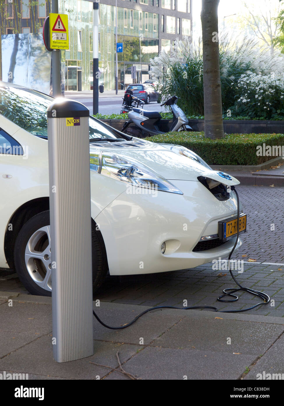 Nissan Leaf electric car plugged in and being charged in Amsterdam, the
