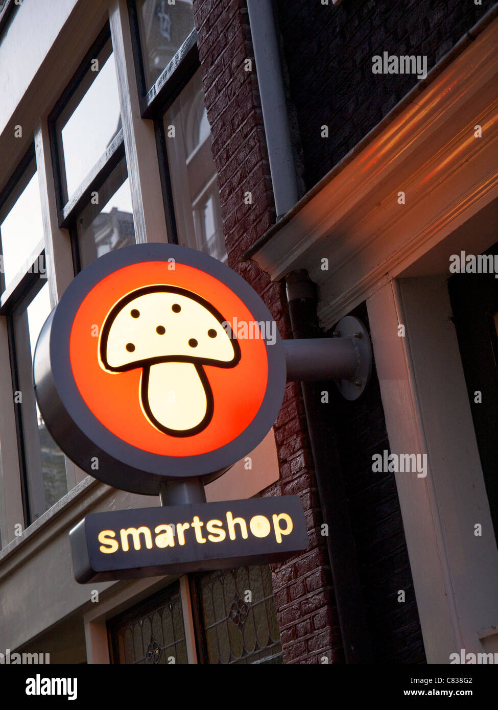Illuminated smartshop sign with magic mushroom, Amsterdam the Netherlands Stock Photo