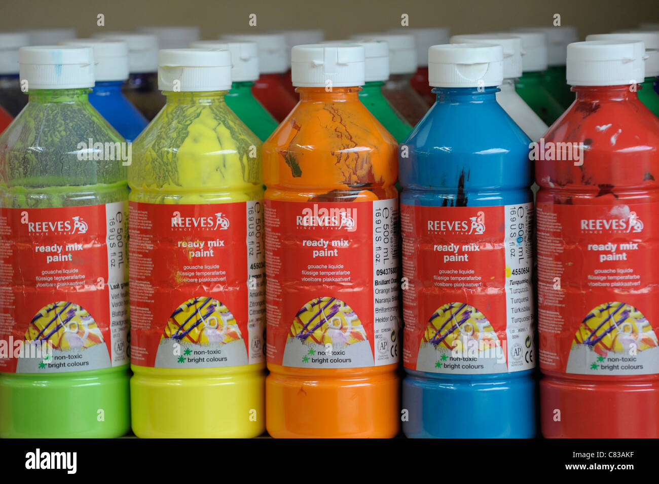 Row of ready-mixed paints in a school art room Stock Photo