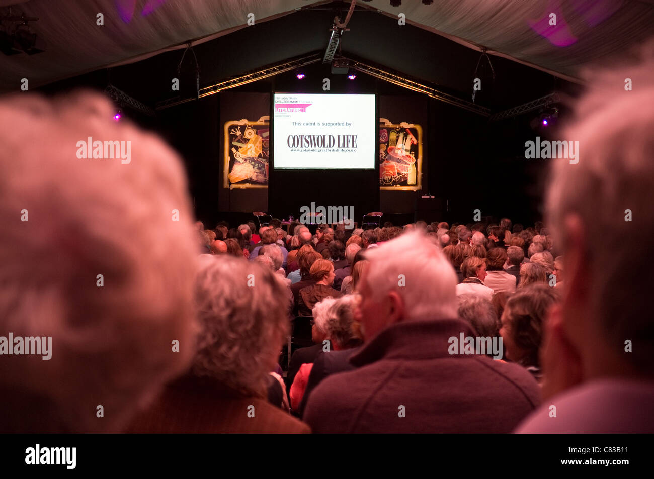 Interior view of tent / audience - awaiting speakers for a Cotswold Life sponsored event at the Cheltenham Literature Festival. Stock Photo