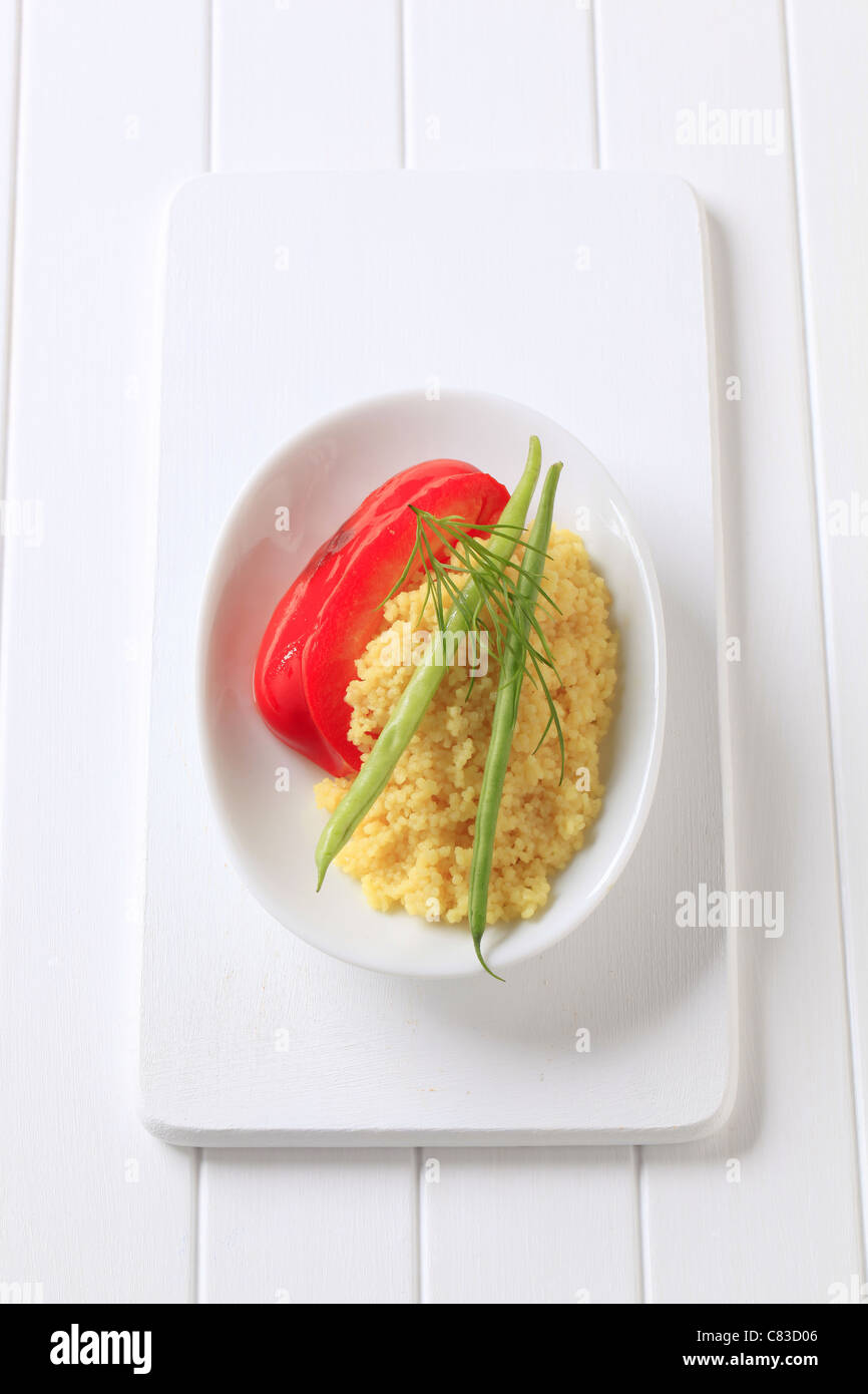 Side dish of couscous garnished with string beans Stock Photo