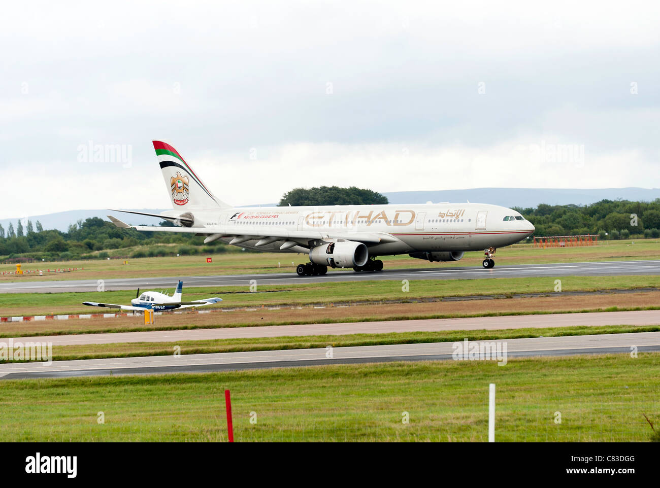 Etihad Airways Airbus A330-243 Passenger Airliner A6-EYG Landing At Manchester International Airport England United Kingdom UK Stock Photo