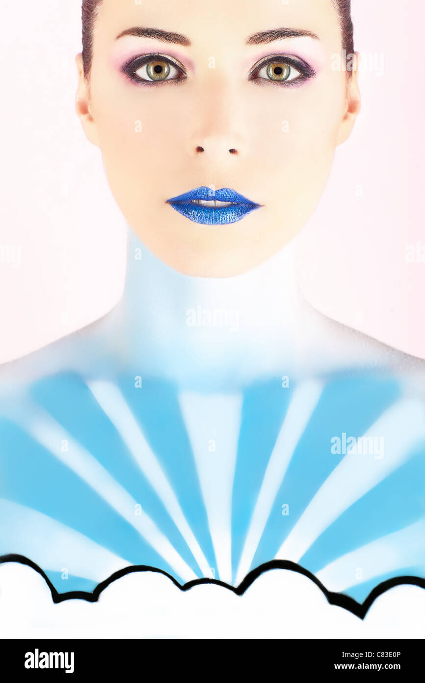 Closeup portrait of a beautiful woman with body painted to look like the sky Stock Photo