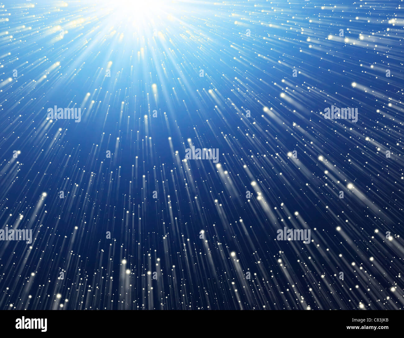 Abstract background. Points of light flying towards the Sun. Stock Photo