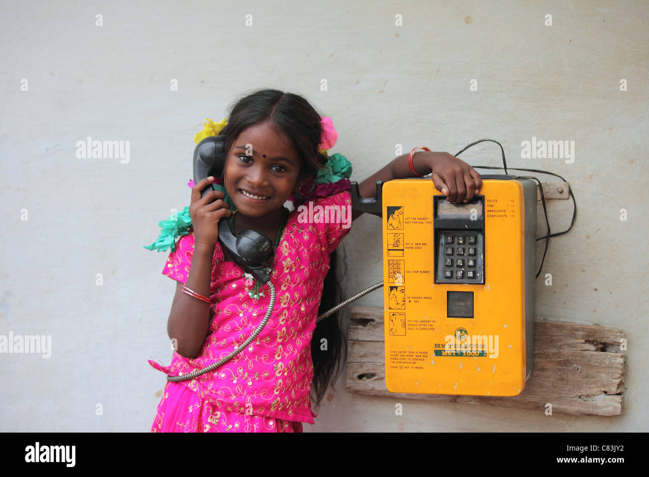 Indian girl using a std local phone Andhra Pradesh South India Stock Photo