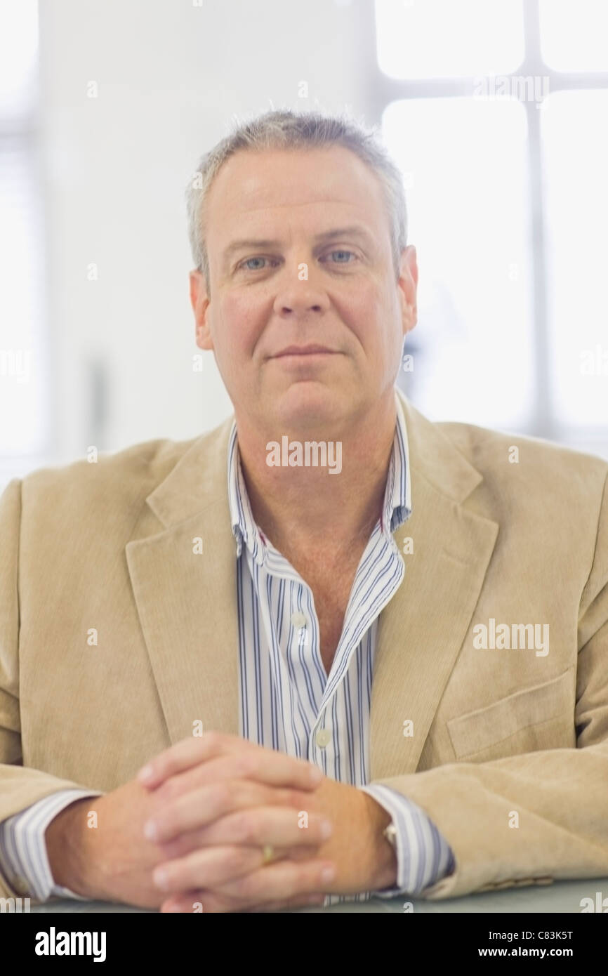 Man sitting hand folding hi-res stock photography and images - Alamy