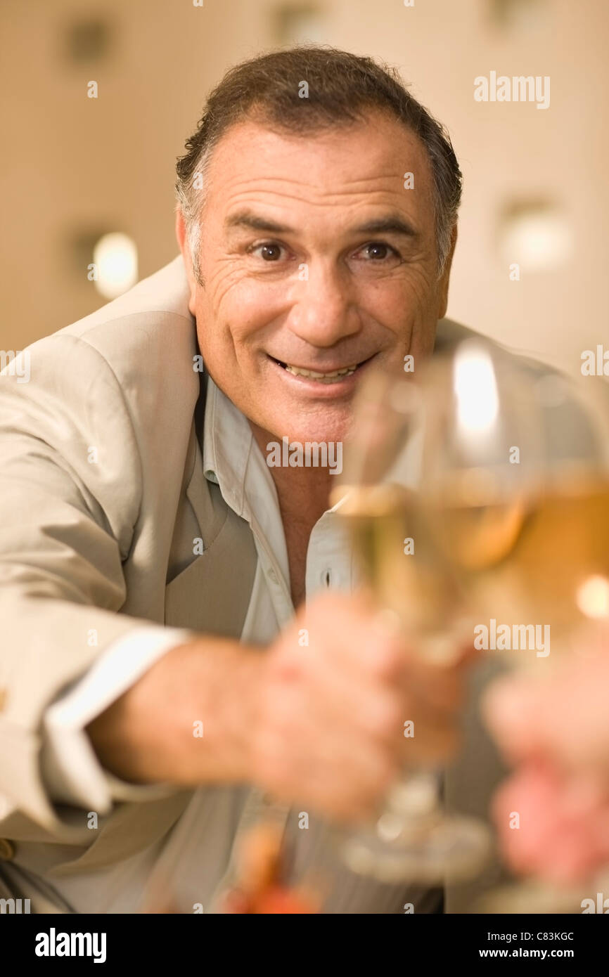 Businessman toasting with glass of wine Stock Photo Alamy