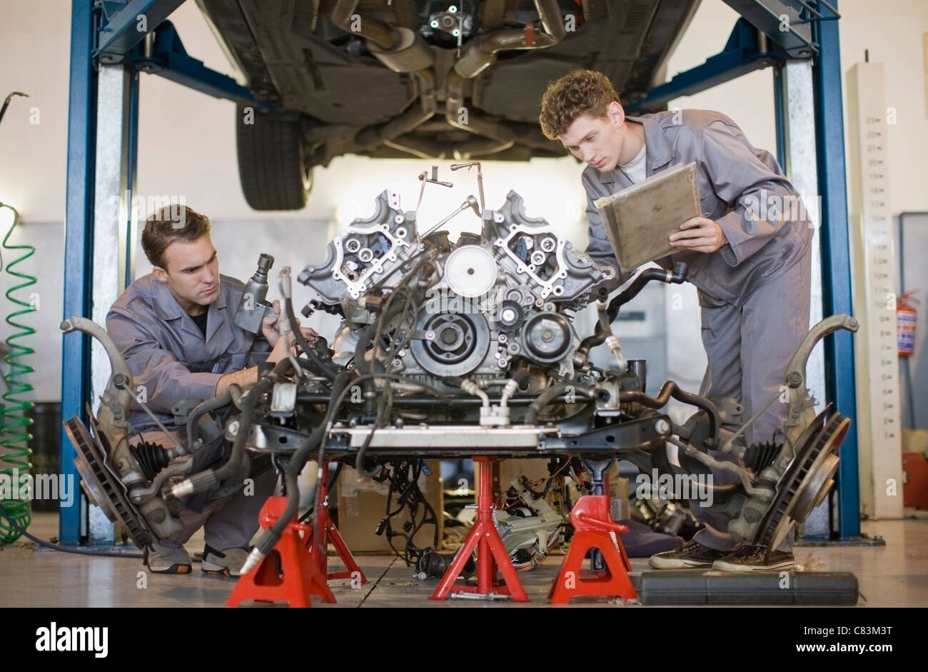 Mechanics Working On Car Engine Stock Photo Alamy Mechanics Working On Car Engine Stock Photo Alamy