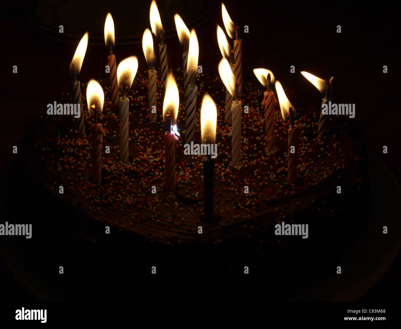 A chocolate cake with candles Stock Photo Alamy