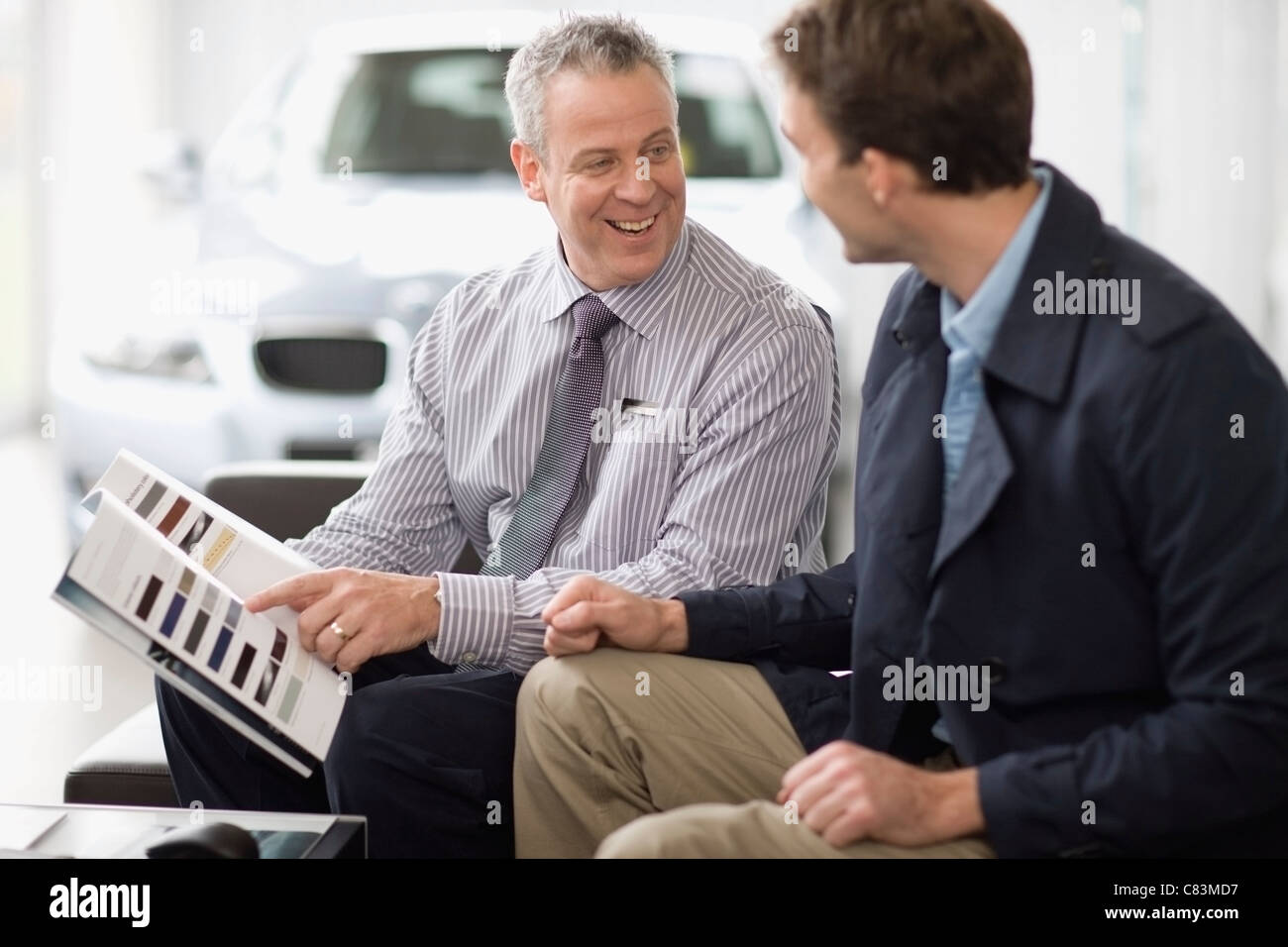 Car salesman talking with customer Stock Photo Alamy