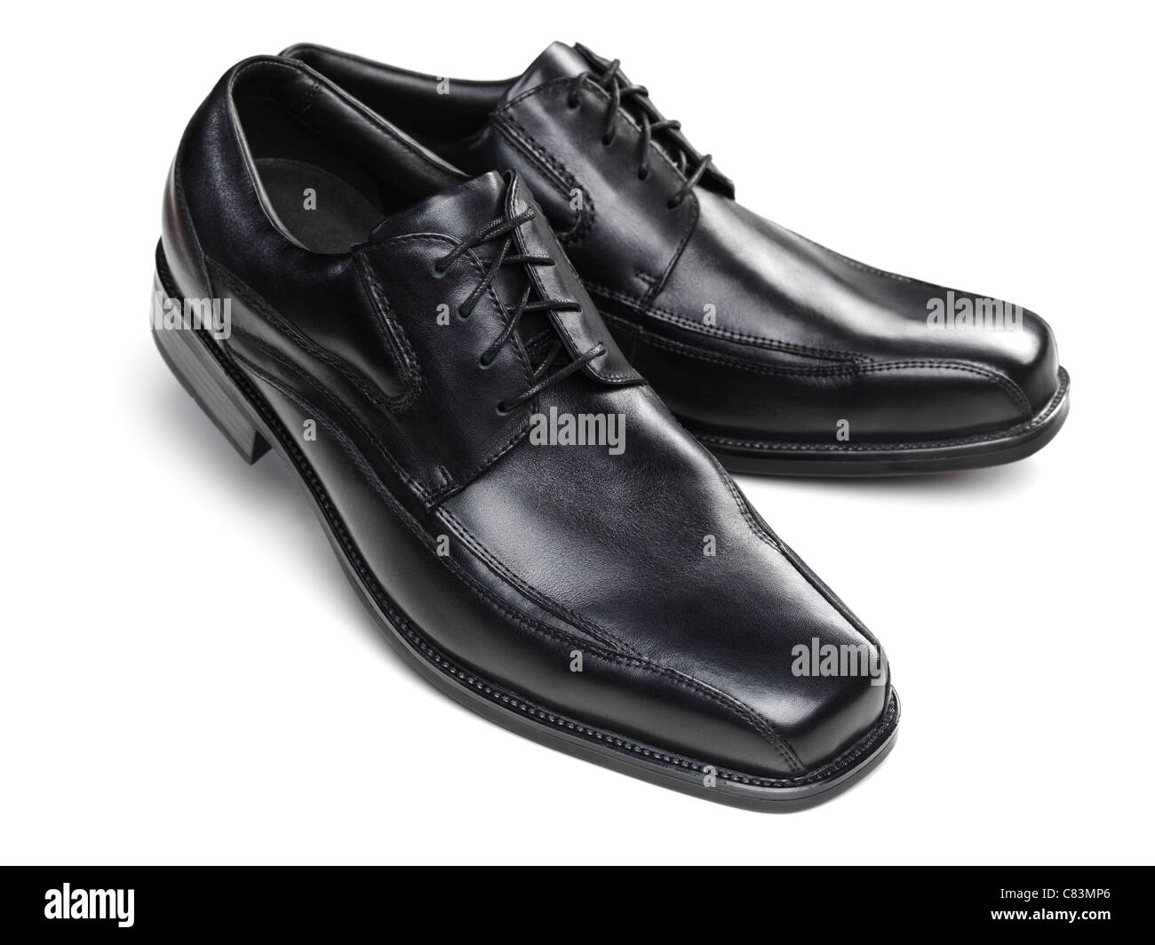 Pair of black mens dress shoes isolated on white background stock photo