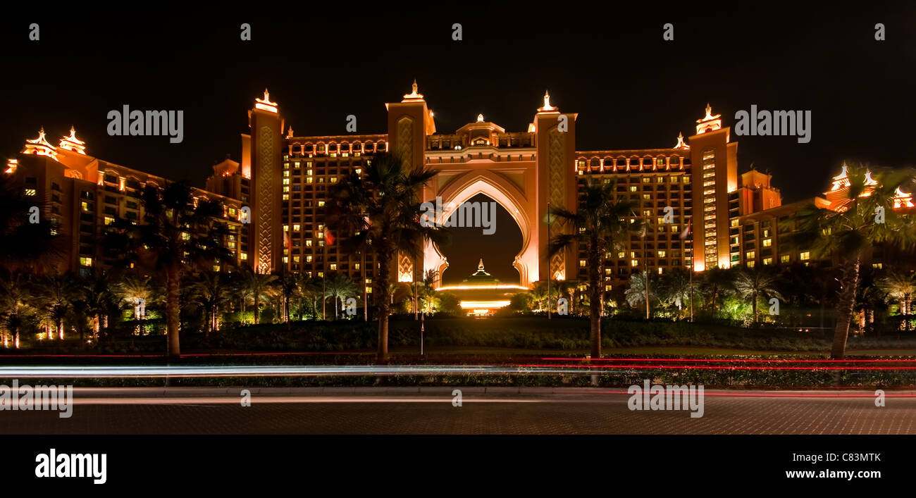 Panoramic view of the Atlantis Resort at night, with car light trails in the foreground, Dubai Stock Photo