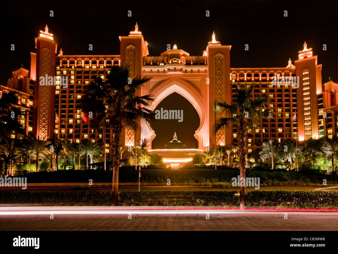 The Atlantis Resort at night, with car light trails in the foreground, Dubai Stock Photo