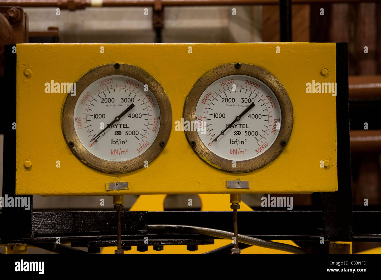 2 yellow high pressure hydraulic gauges gage Stock Photo Alamy
