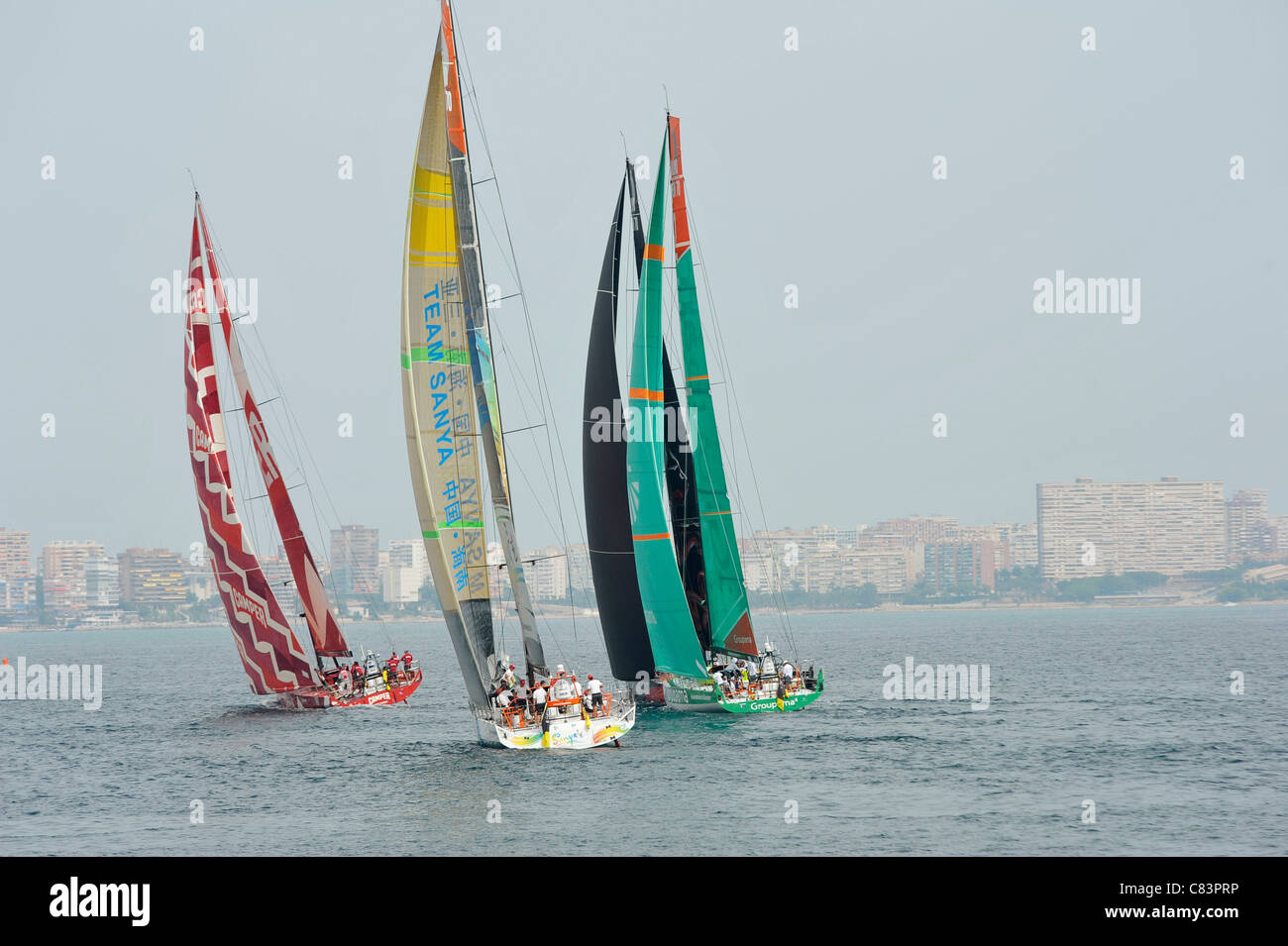 Teams Camper,Sanya,Groupama and Puma (from left) during trial leg of Volvo  Ocean Race in Alicante Bay, Spain Stock Photo - Alamy