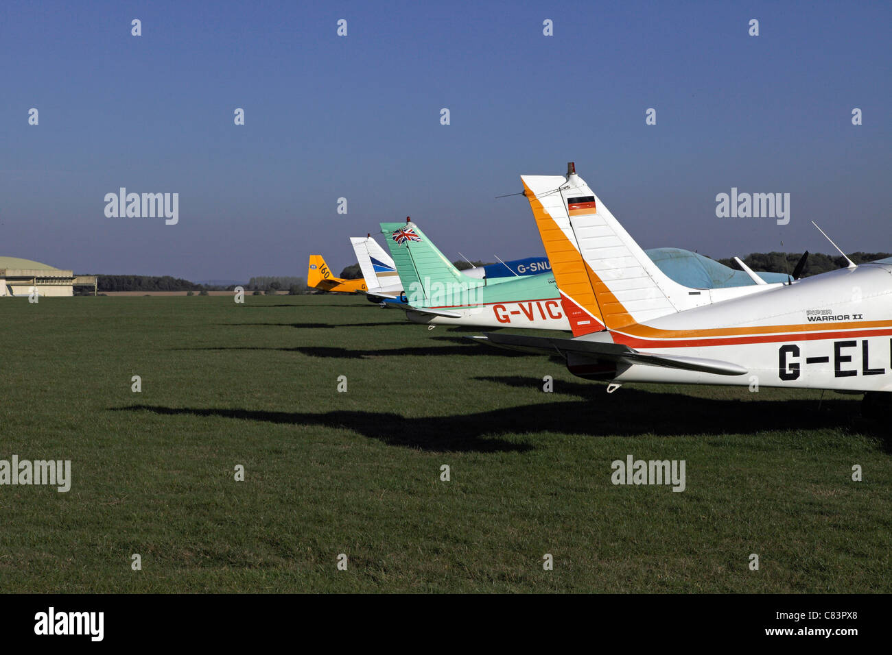 Private prop planes on an airfield. Cotswold Airport Stock Photo