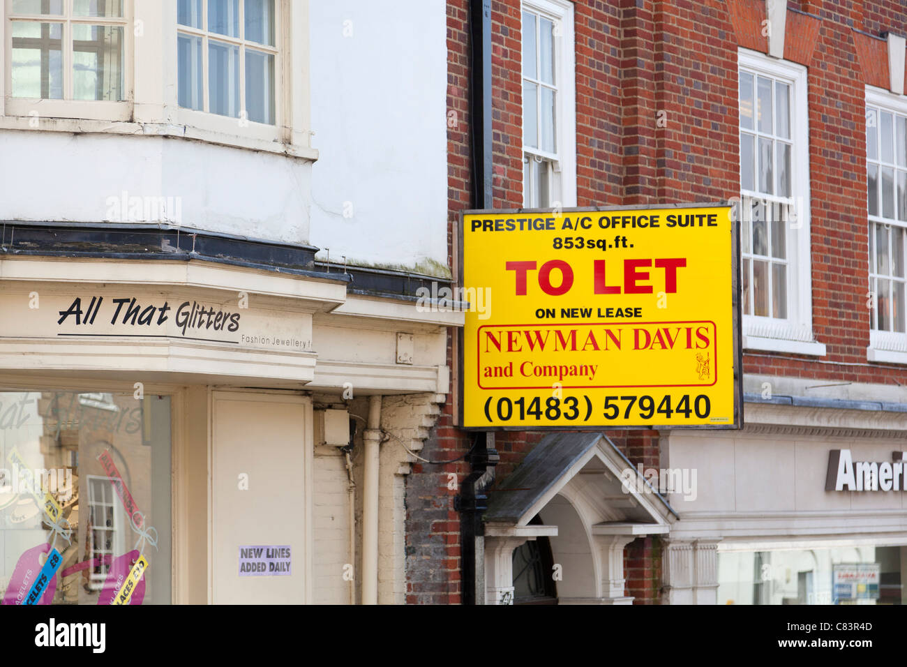 large 'to let' sign over a doorway in the high street Stock Photo