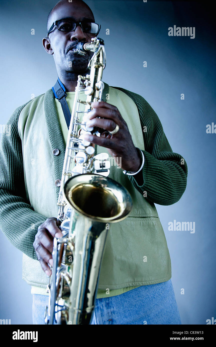 Black musician playing saxophone Stock Photo Alamy