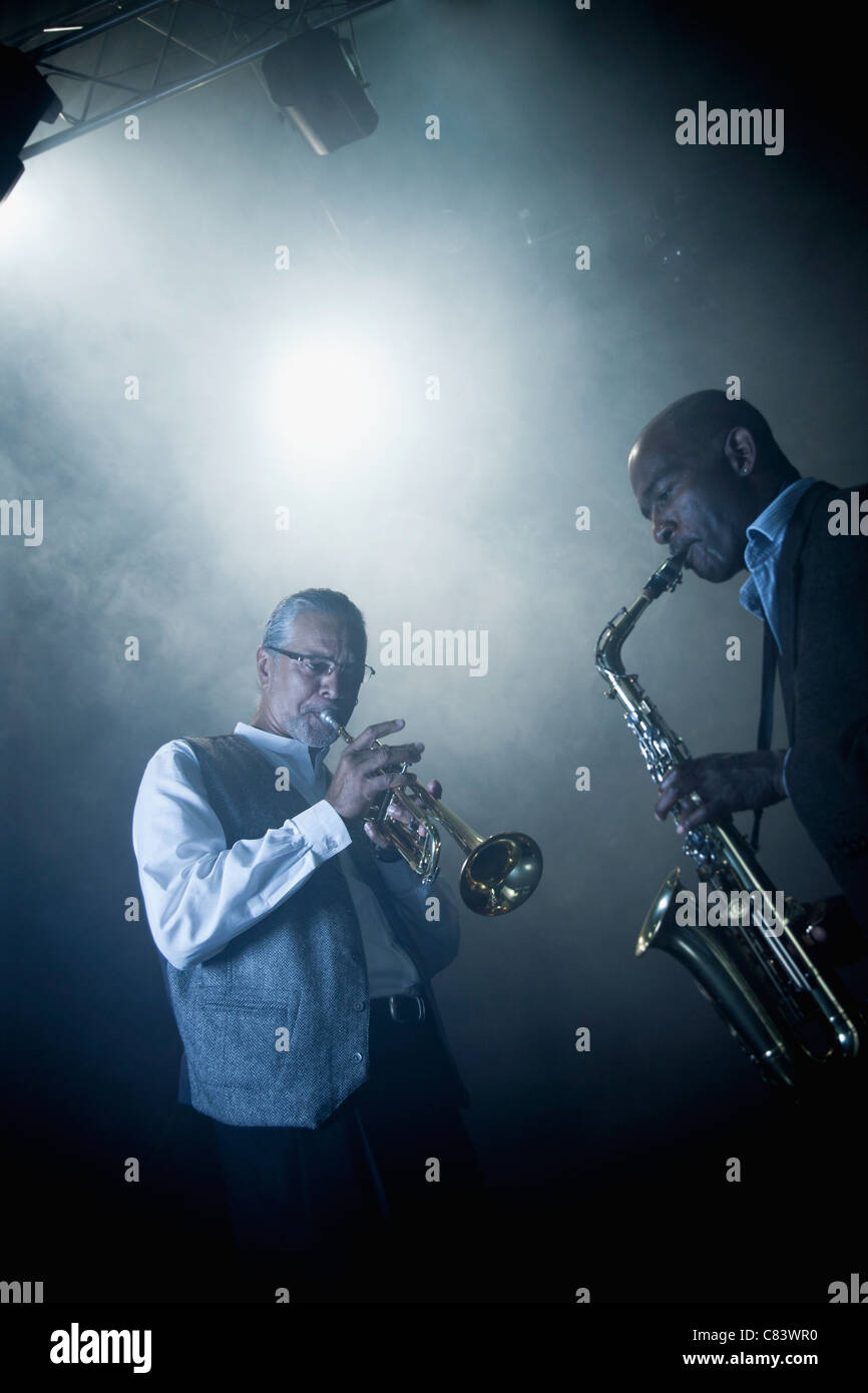 Musicians playing in jazz band on stage Stock Photo